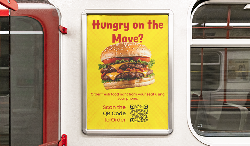 Poster inside a train asking Hungry on the Move? with a large image of a burger and a QR code to order food right from a seat.